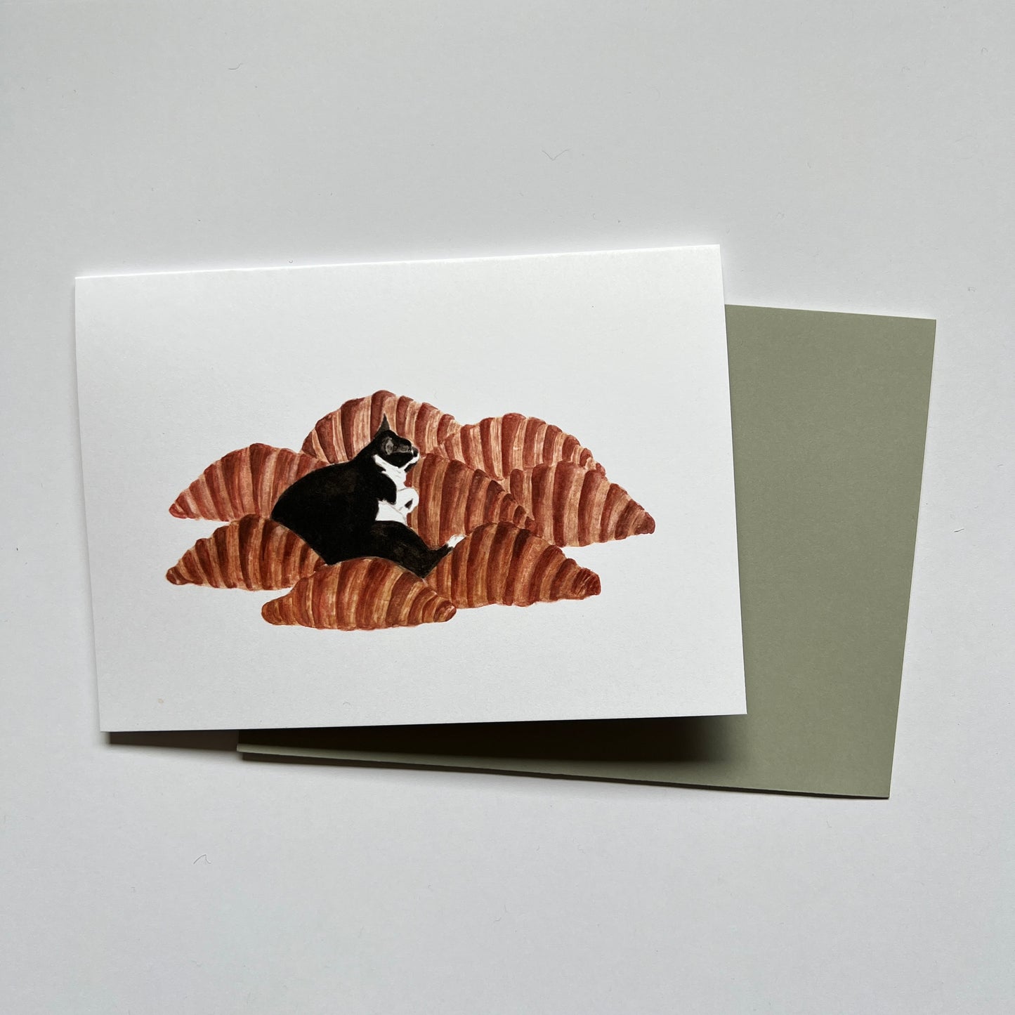 Cat on Croissants Greeting Card