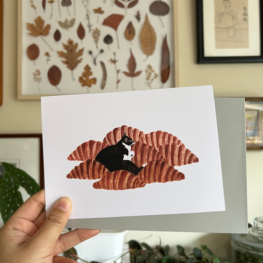 Cat on Croissants Greeting Card