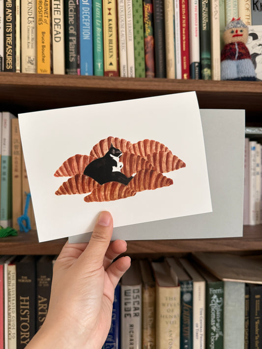 Cat on Croissants Greeting Card